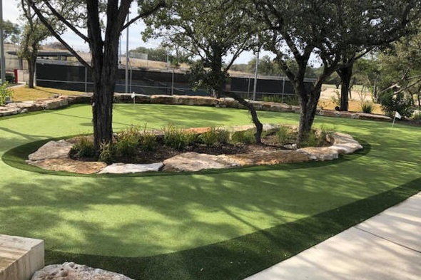 Flagstaff residential backyard putting green grass